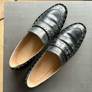 Black leather loafers with silver stud embellishments by LF Life Style L-Mine